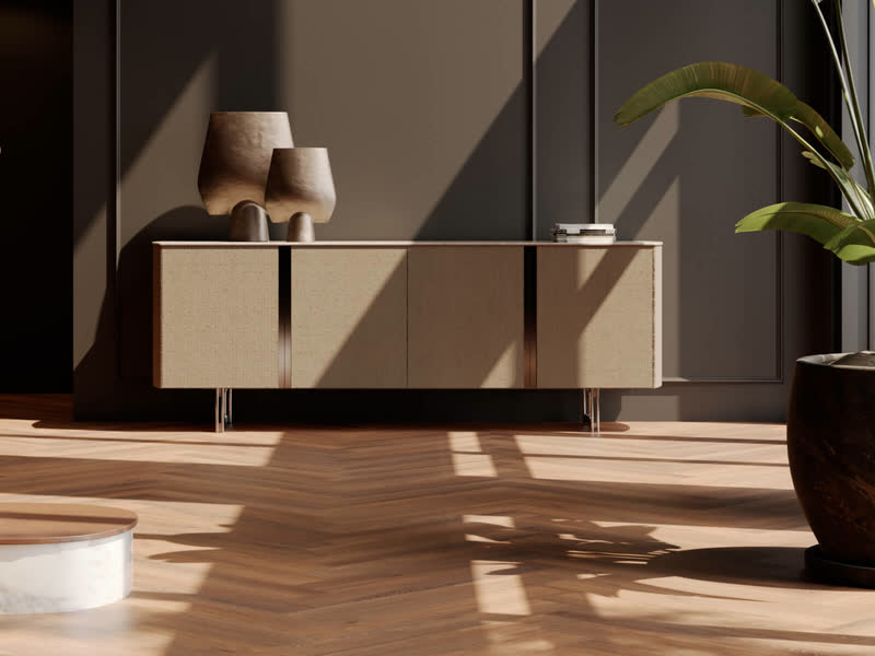 Dressoir met vazen en een plant op een goudkleurige visgraatvloer van Room5 Executive Gold